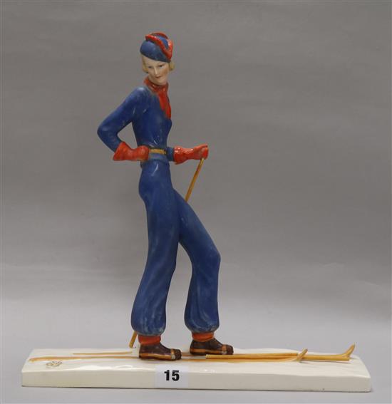 A William Goebel Art Deco pottery figure of a woman skier, height 32.5cm, ski poles re-attached